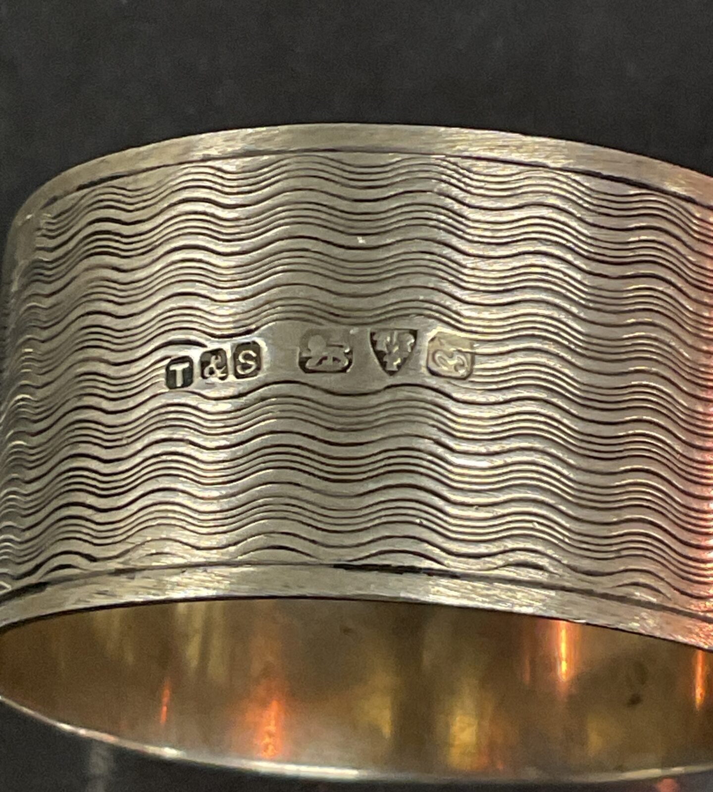 Hallmarked sterling silver napkin ring with maker's mark.