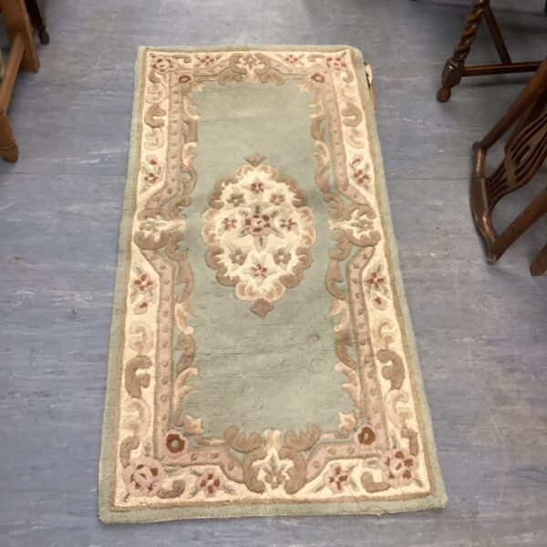 Green Chez-toi Shensi Dynasty wool rug with intricate design.
