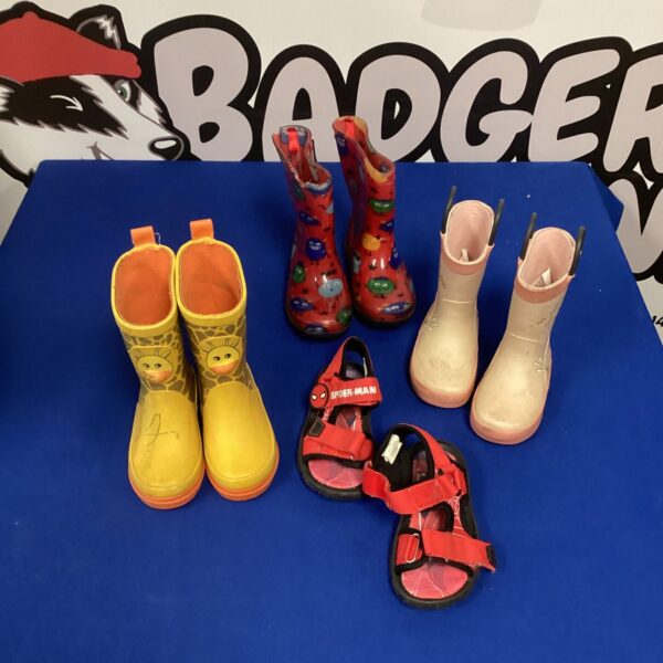 Colourful children's wellington boots and Spider-Man sandals lot for outdoor play.