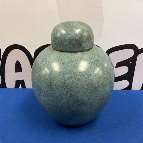 Vintage Chinese lidded pot with speckled green glaze.