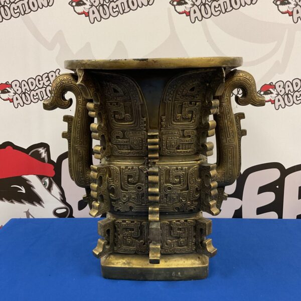Large resin Chinese plant pot stand with bronze effect finish.