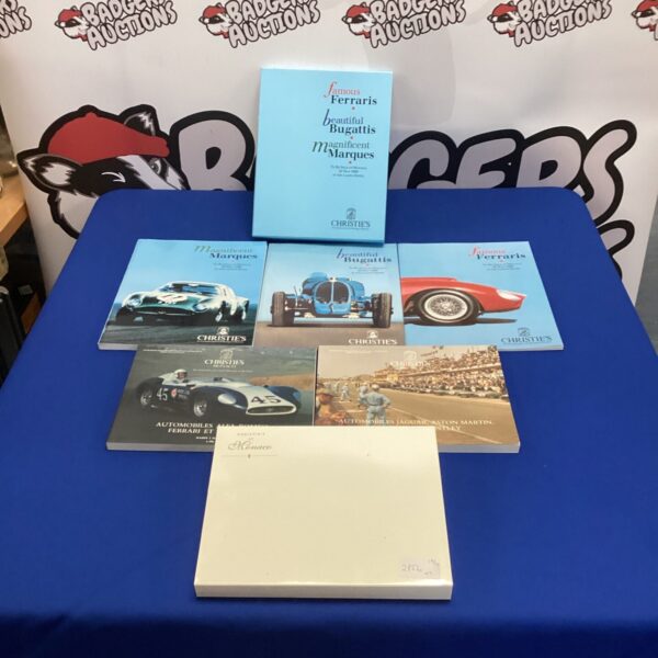 Christie's auction catalogues featuring Ferrari and Bugatti sports cars.