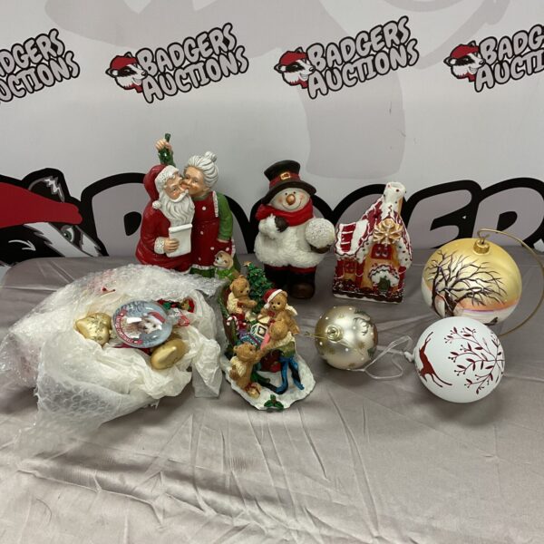 Box of vintage Christmas decorations with a musical sleigh.