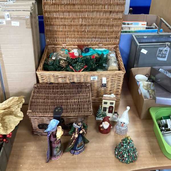 Wicker baskets filled with a colourful lot of Christmas decorations.
