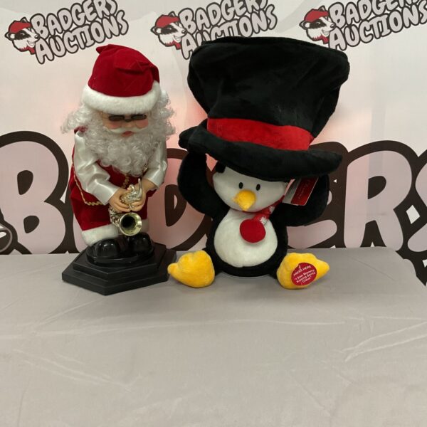 Singing Santa and Clinton penguin Christmas decorations, festive holiday decor.