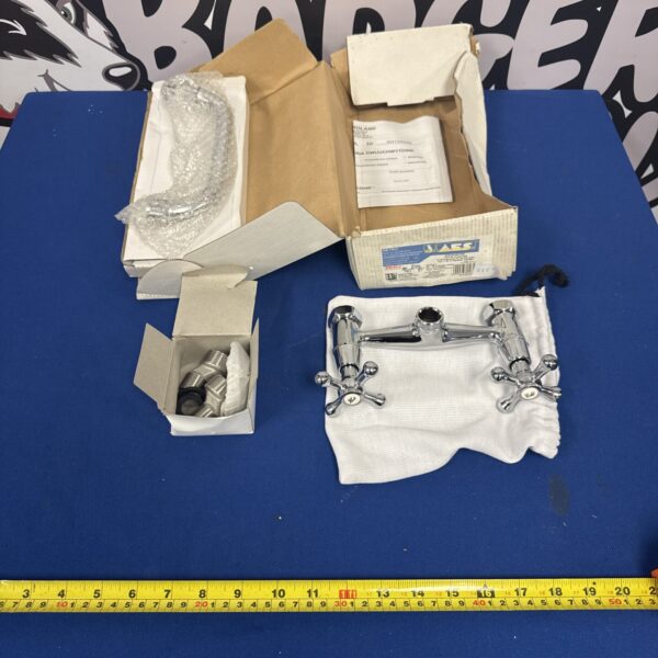 New chrome basin mixer tap in original packaging.