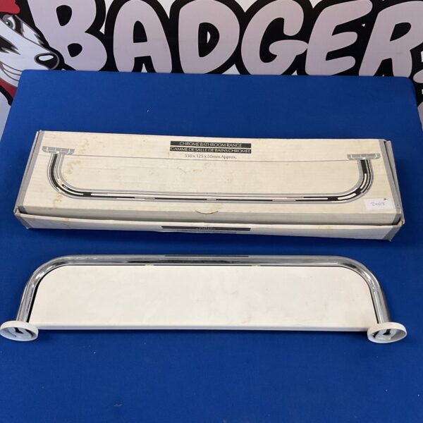 New chrome and white bathroom shelf in original packaging.