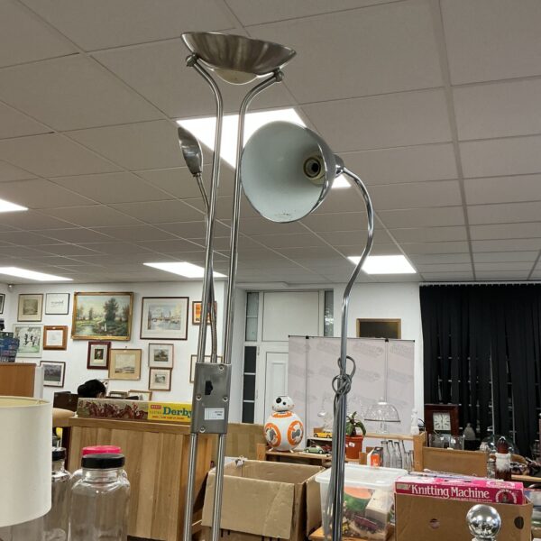 Pair of vintage chrome standard lamps with adjustable heads.