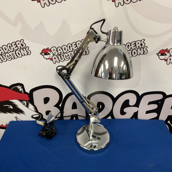 Adjustable chrome table lamp with a classic mid-century modern design.