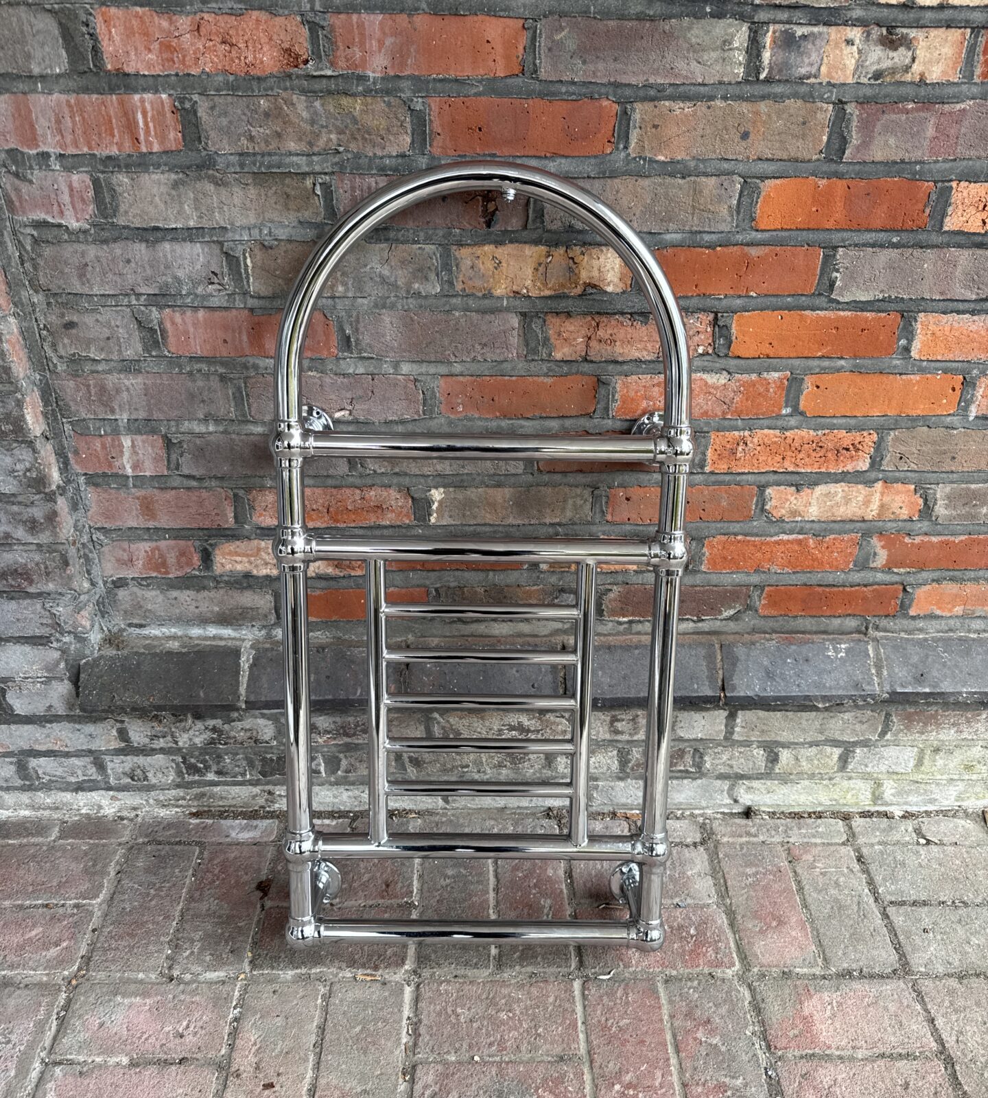 Vintage chrome towel rail for bathroom heating.