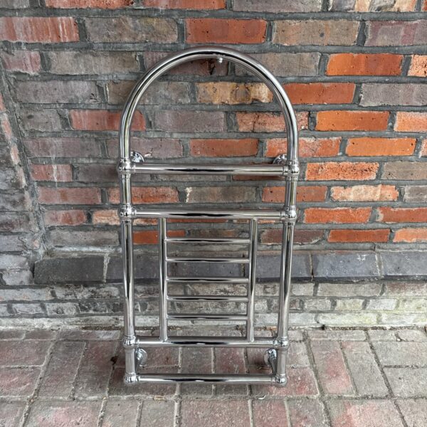 Vintage chrome towel rail for bathroom heating.