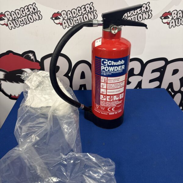 Vintage red Chubb powder fire extinguisher with full gauge.