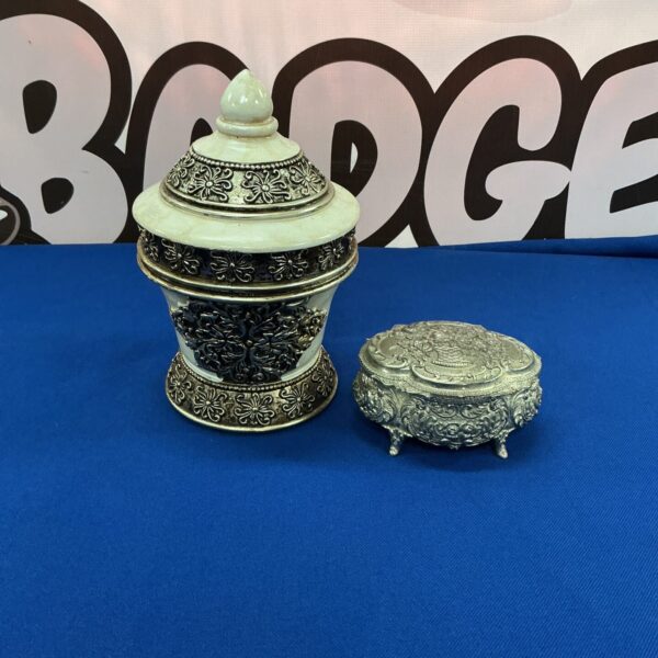 Vintage cinnabar style pewter trinket box with intricate detailing.