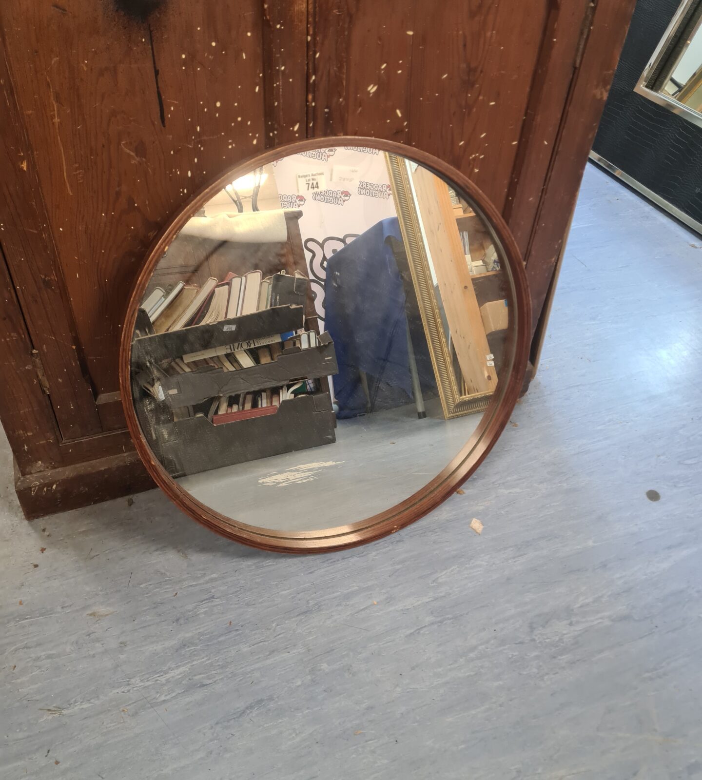 Vintage circular framed mirror with wooden frame.