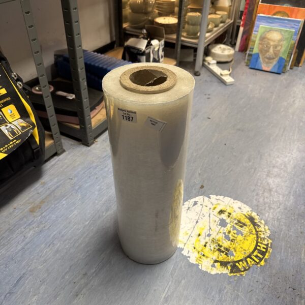 Roll of clear plastic sheeting for DIY projects and protection.