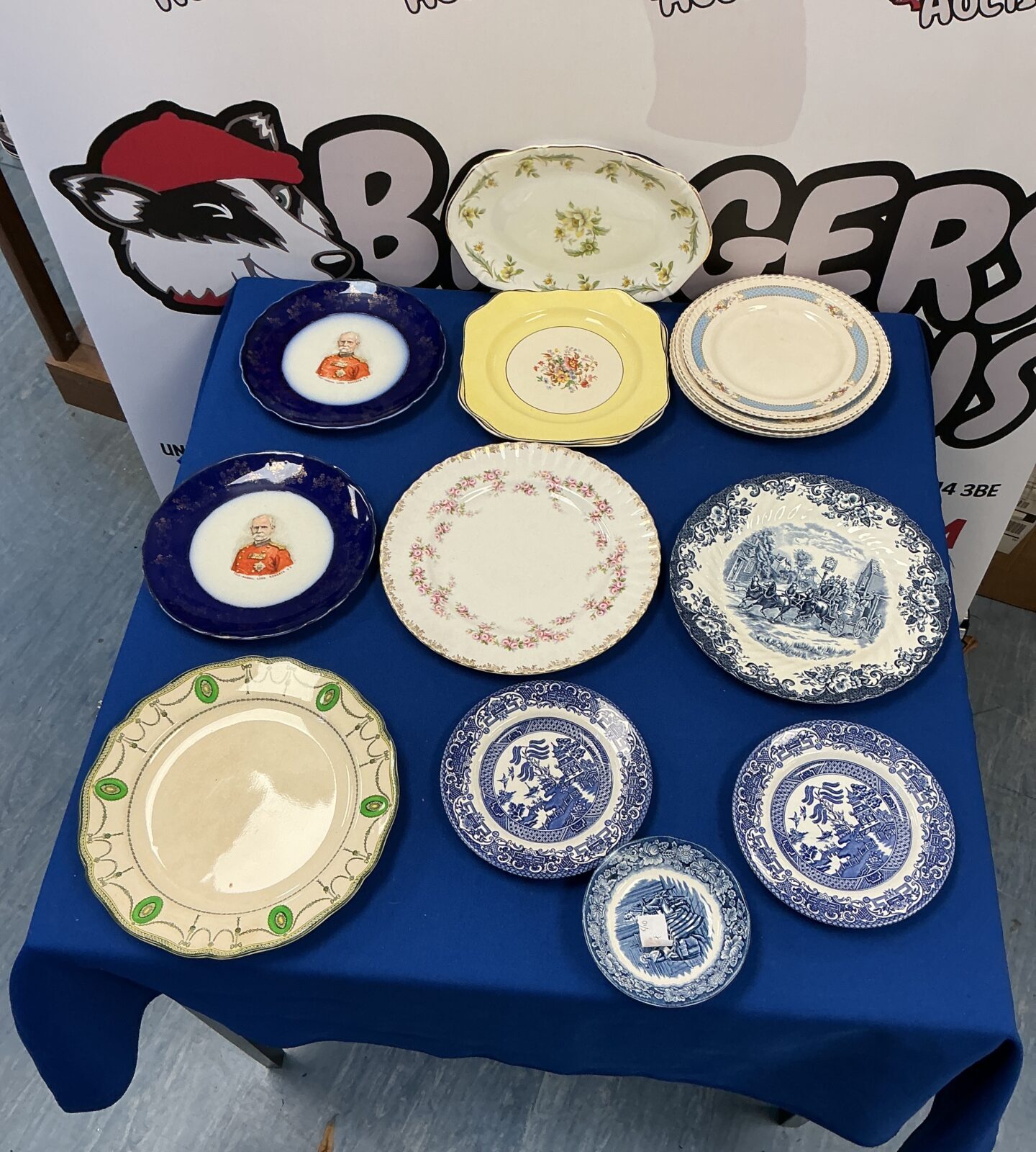 Selection of vintage collectible plates including Royal Albert china.