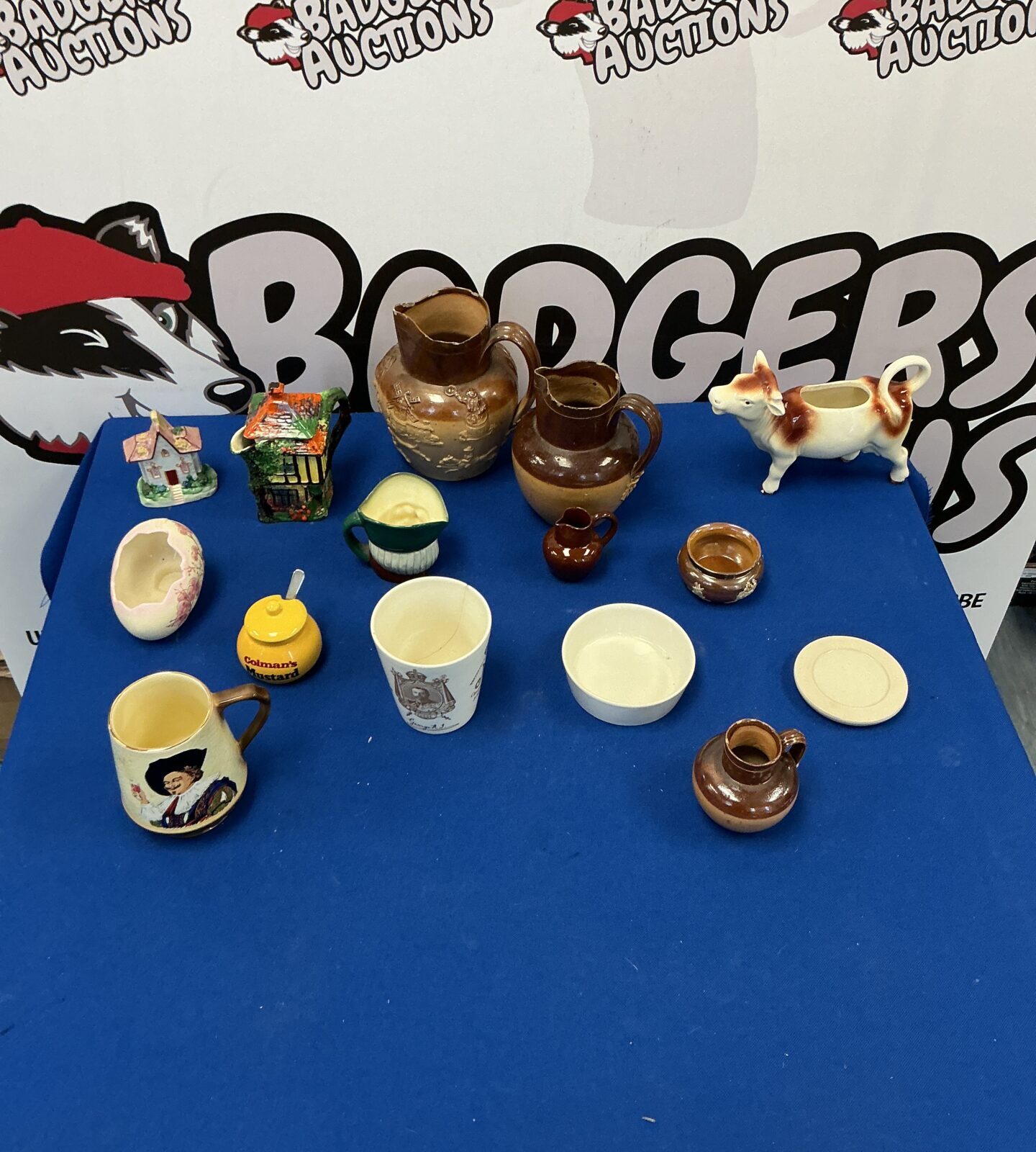 Vintage Colmans Mustard jar with other ceramic collectibles.