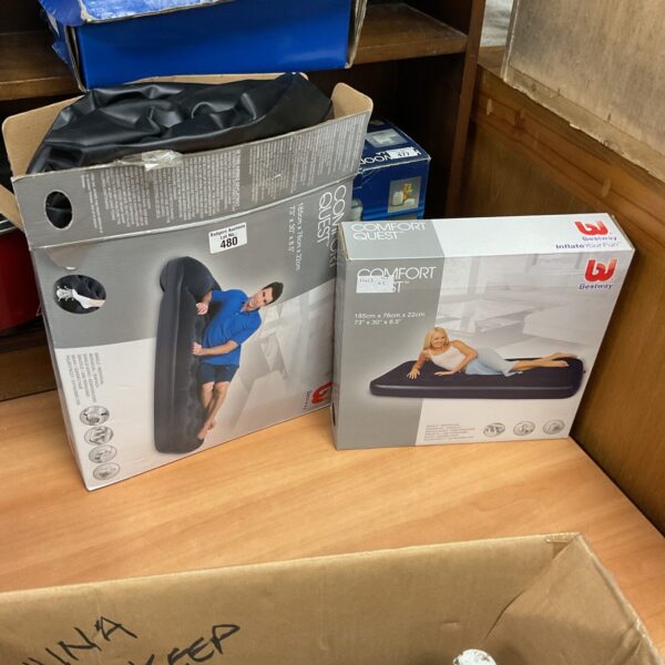 Two Comfort Quest inflatable beds in packaging.