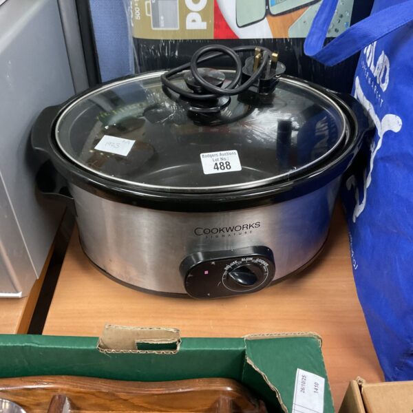 Cookworks slow cooker with ceramic pot, used kitchen appliance.