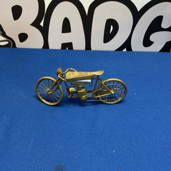 Detailed copper desktop motorcycle sculpture for collectors.