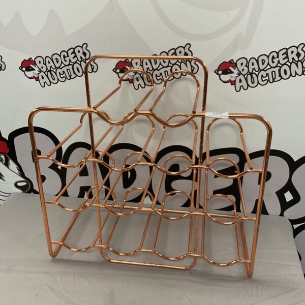 Copper wine rack holding fourteen bottles, stylish wine storage.