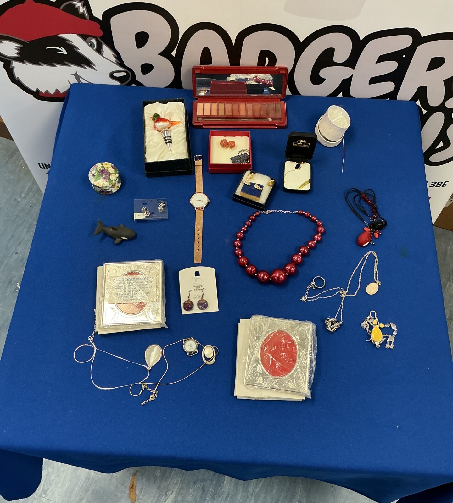 Mixed lot of vintage and costume jewellery with a red necklace.