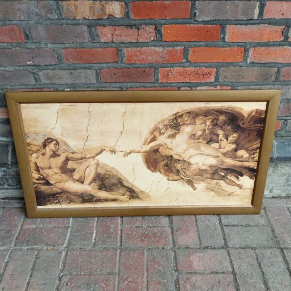 Reproduction of Leonardo da Vinci’s Creation of Adam print for wall decor.