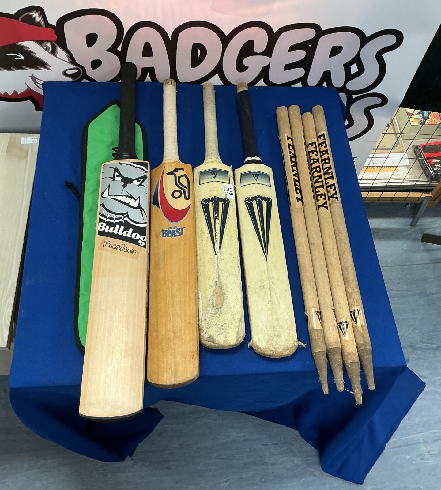 Cricket bats and stumps lot including Bulldog Basher bat.