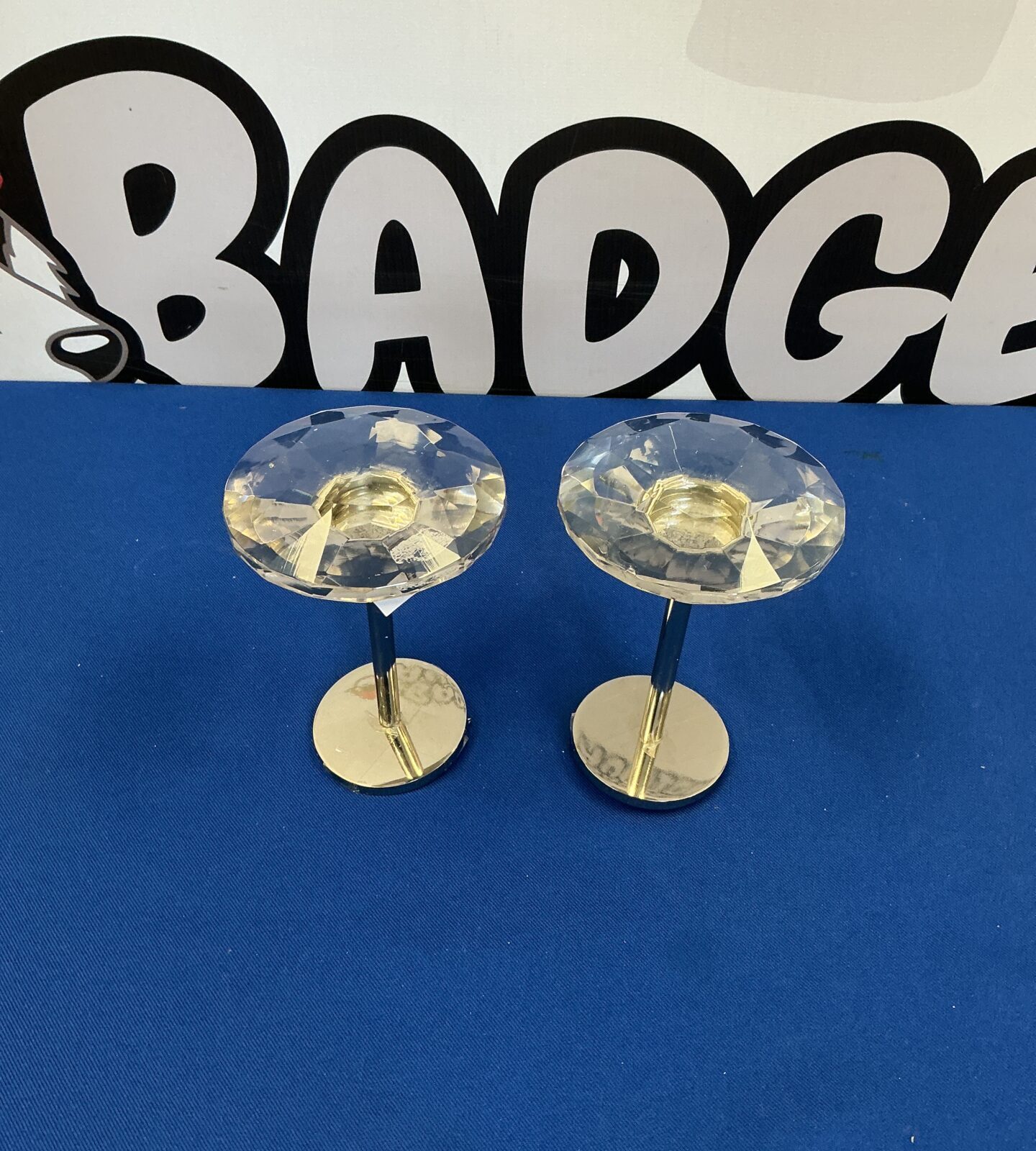 Clear crystal curtain tiebacks with silver arms.