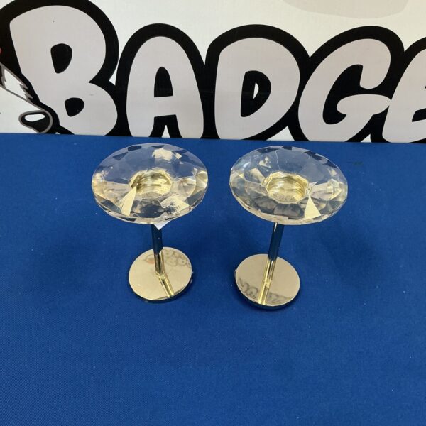Clear crystal curtain tiebacks with silver arms.