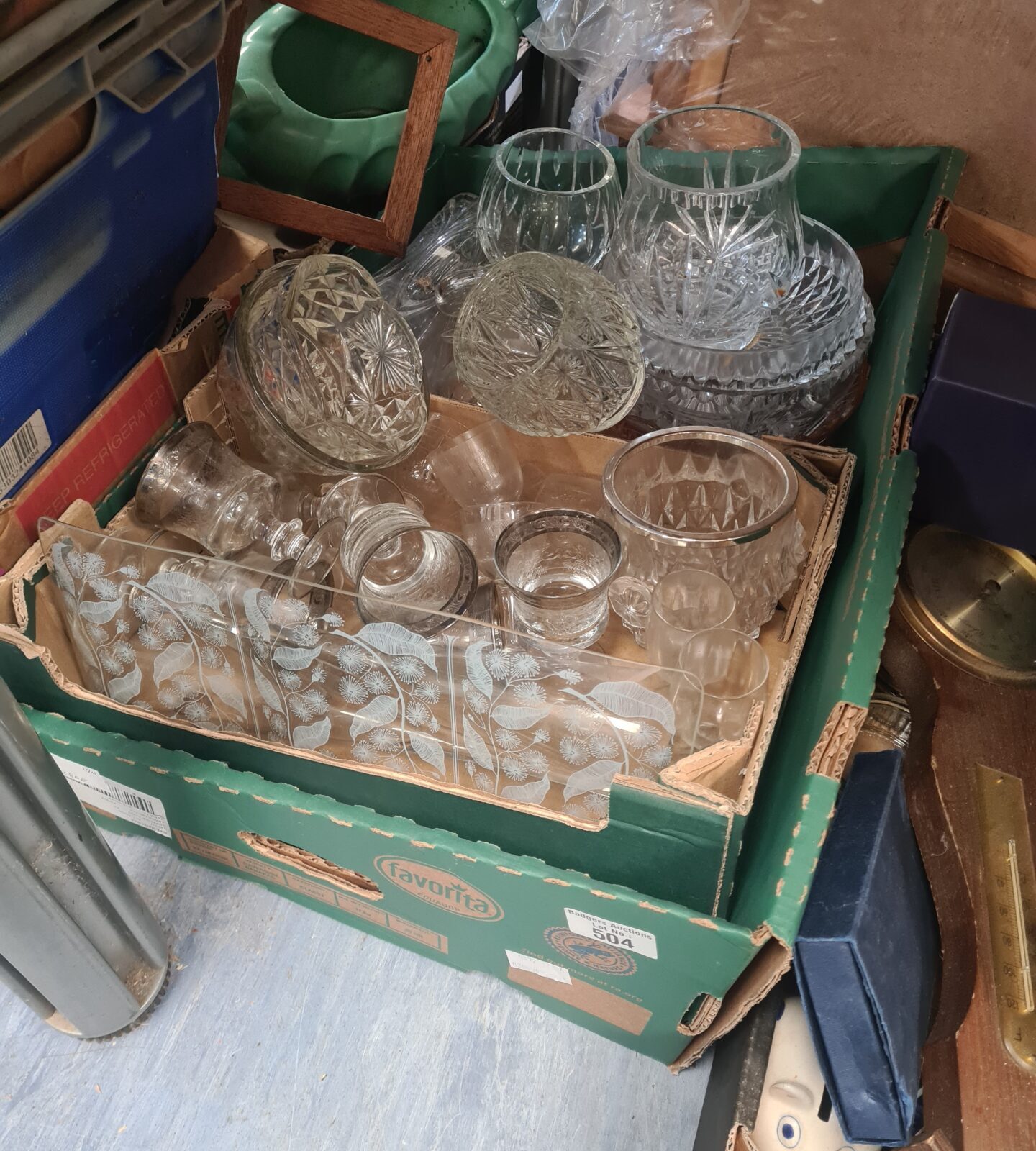Mixed lot of vintage crystal cut glassware on display.