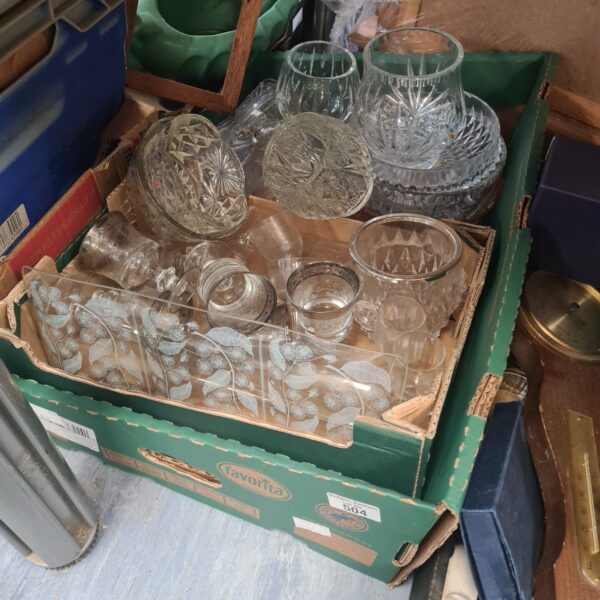Mixed lot of vintage crystal cut glassware on display.