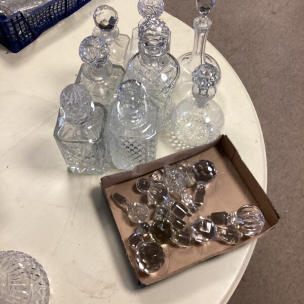 Lot of eight crystal and cut glass decanters for sale.