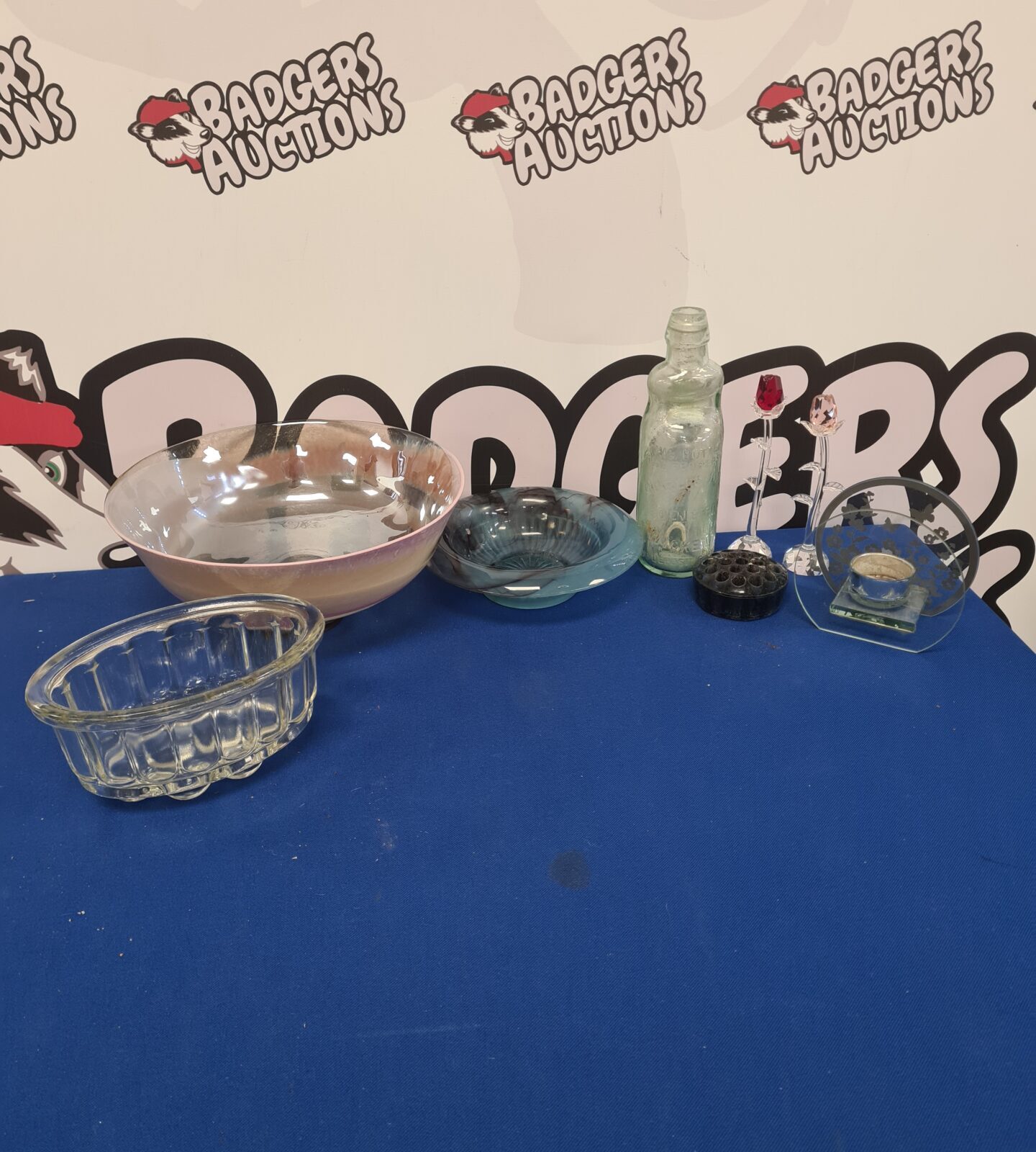 Vintage crystal glassware collection featuring rose and poppy designs.