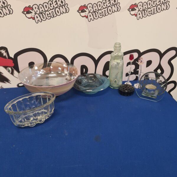 Vintage crystal glassware collection featuring rose and poppy designs.