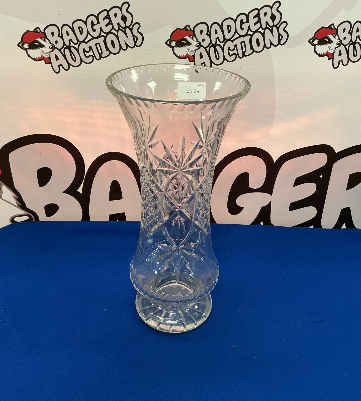 Elegant 15 inch tall crystal vase with intricate cut design.