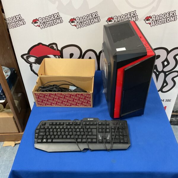Custom gaming PC tower with keyboard and mouse included.