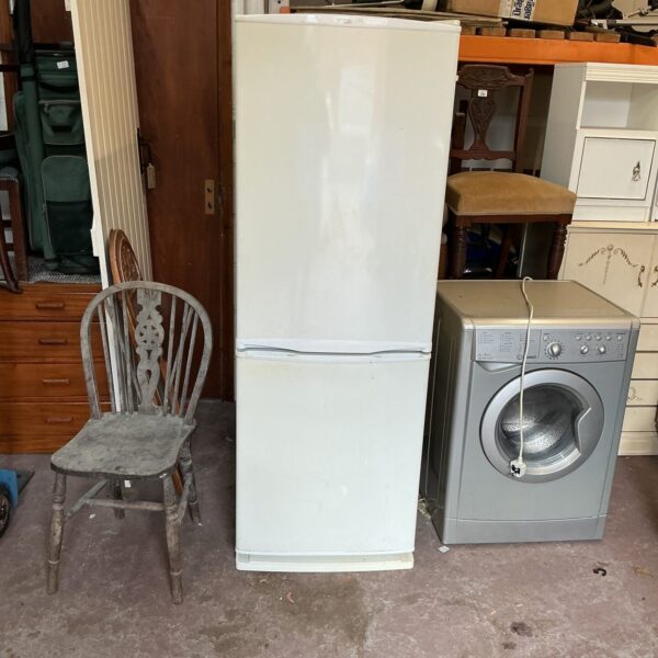 White Daewoo fridge freezer in used condition, ideal for kitchen storage.