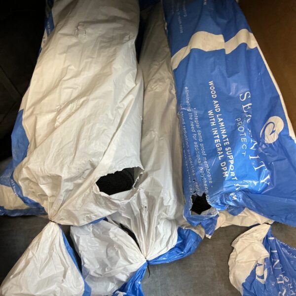 Five rolls of damp proof membrane for construction and moisture control.