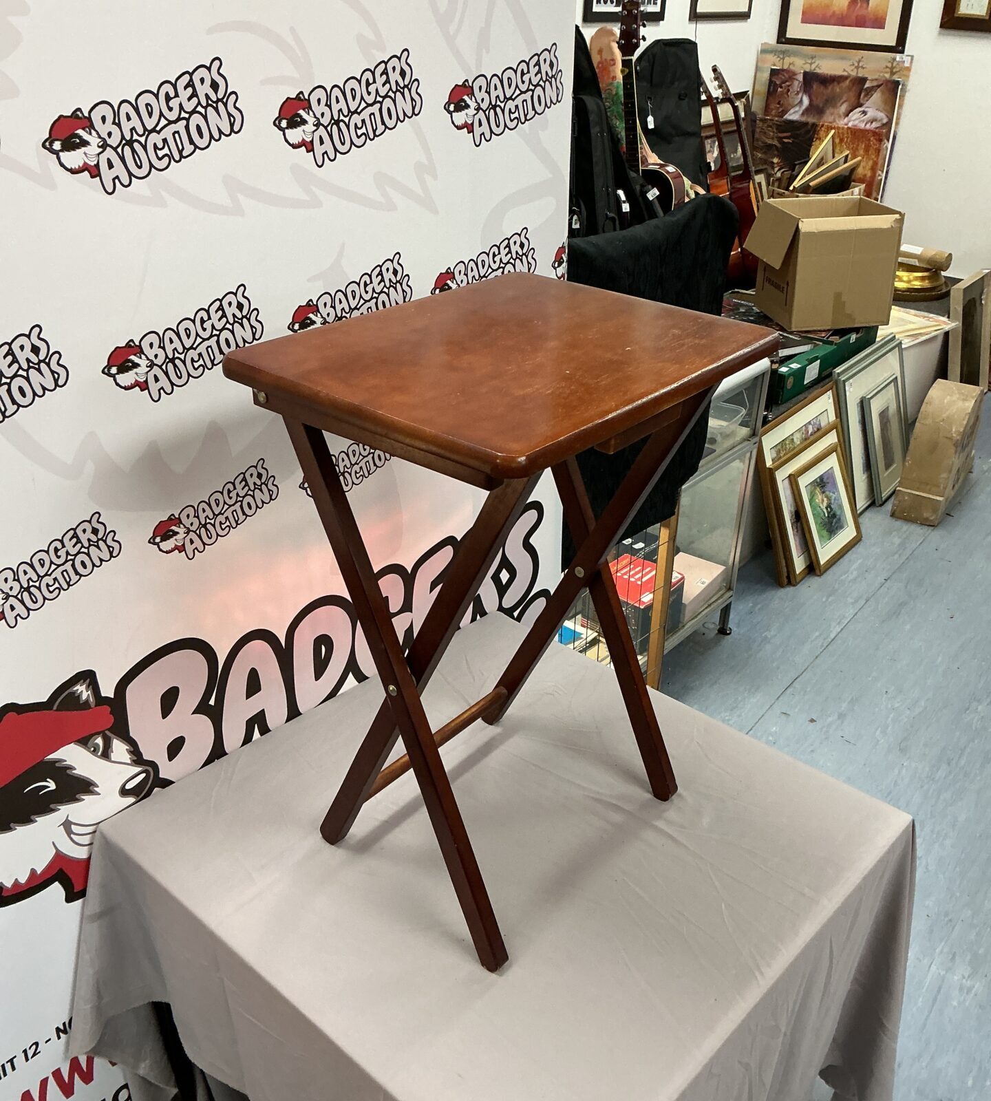 Vintage dark wood folding side table in good condition.