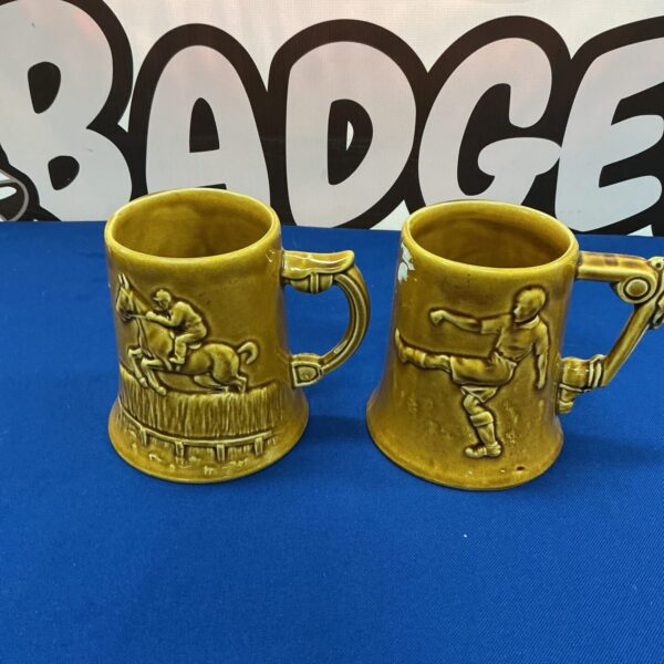 Vintage Dartmouth Pottery tankard with character detail.