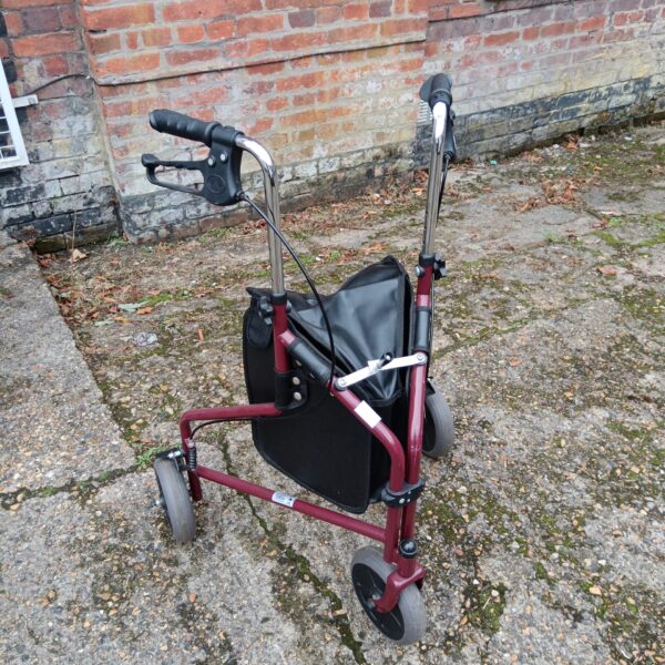 Red Days folding mobility walker with shopping basket.
