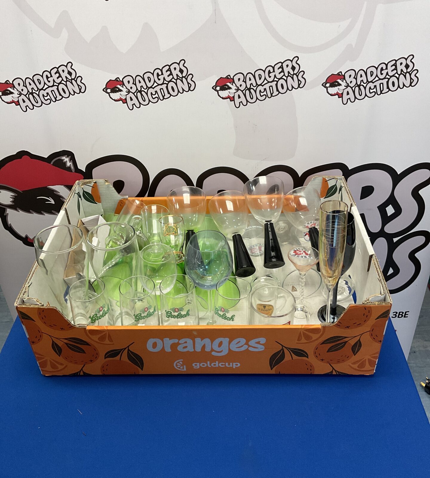 Assortment of colourful decorative glassware in a display lot.