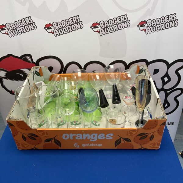 Assortment of colourful decorative glassware in a display lot.