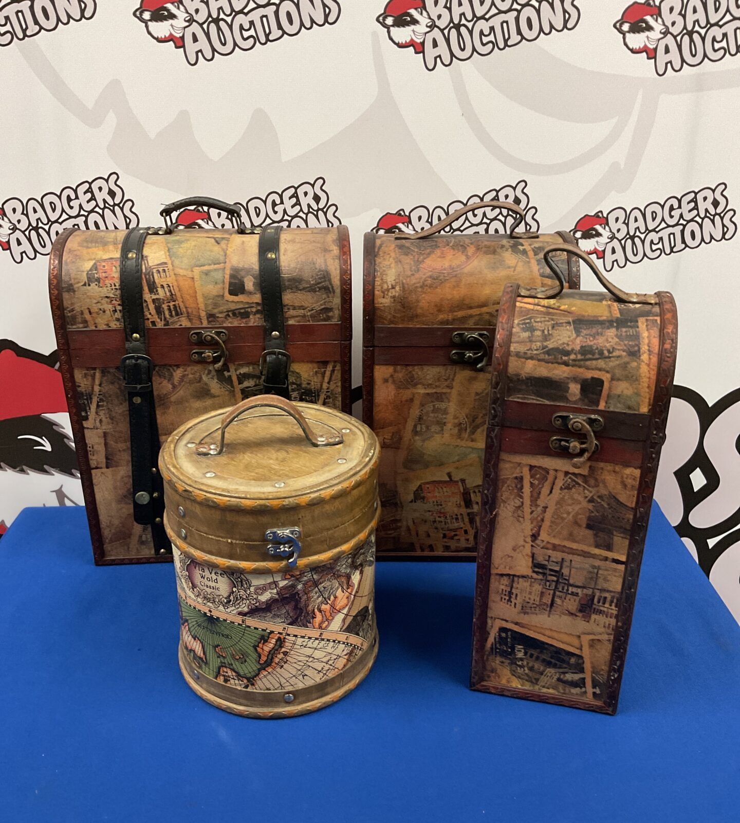 Lot of four decorative wooden wine boxes with vintage map designs.