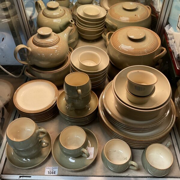 Large collection of vintage Denby green stoneware dinner service pieces.