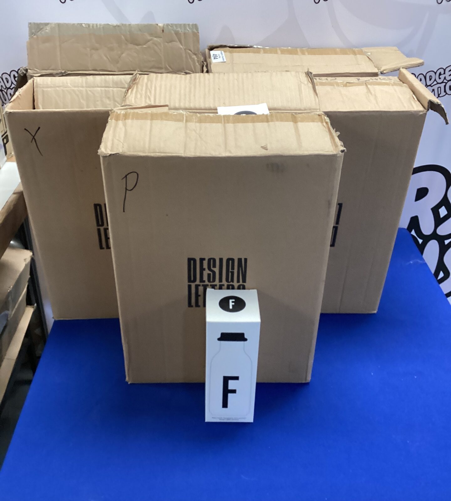 Lot of five boxed Design Letters drinks flasks.