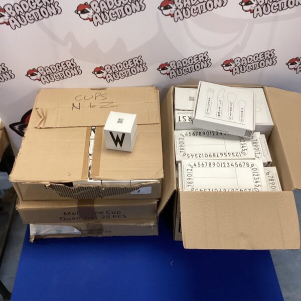 Four boxes of unopened Design Letters kids’ dinnerware and lettering sets.