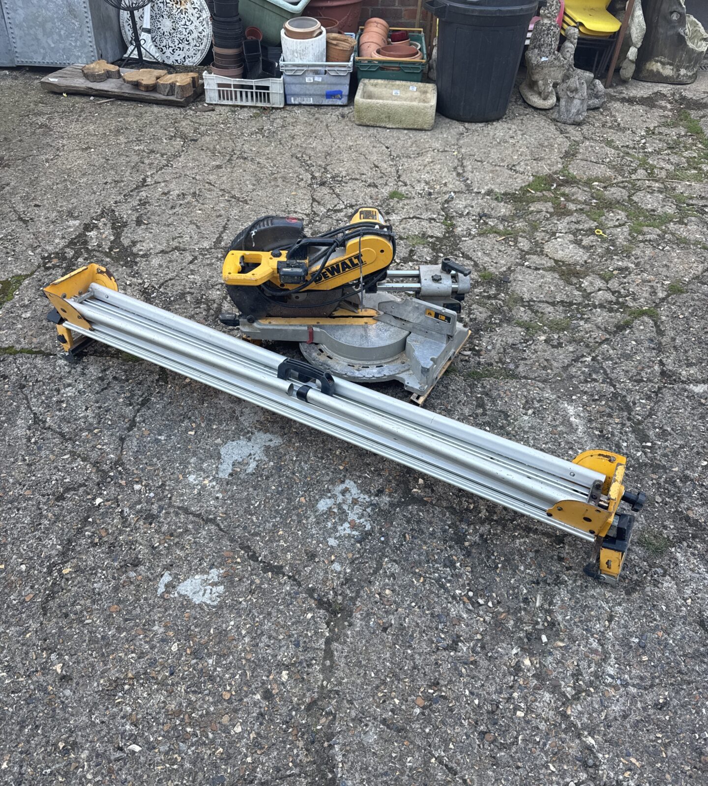Dewalt DW718XPS-LX mitre saw in used condition, ideal for woodworking.