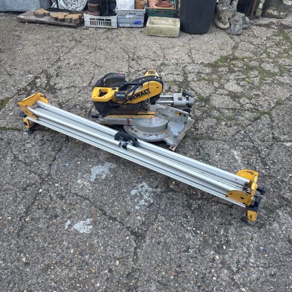 Dewalt DW718XPS-LX mitre saw in used condition, ideal for woodworking.